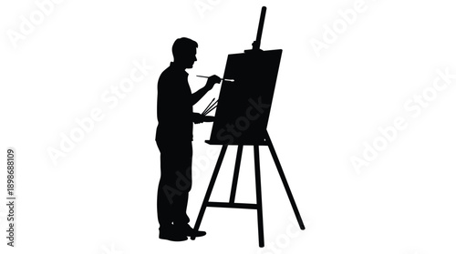 Artist painting at an easel a striking black silhouette