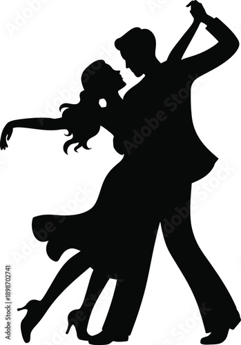 Dynamic silhouette of a couple performing a passionate tango dance.