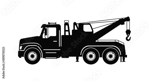A stark black silhouette depicts a heavy duty tow truck with a raised boom and hook showcasing industrial power and utility silhouette