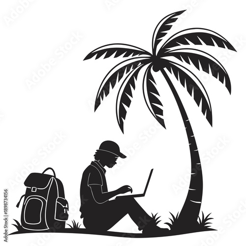 A man sits under a palm tree working on his laptop