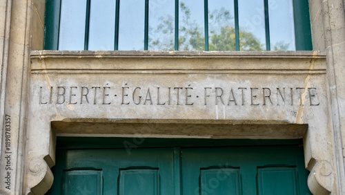 French National Motto - Liberté, Égalité, Fraternité (Liberty, Equality, Fraternity) - Inscribed in Stone above Doorway in Paris
