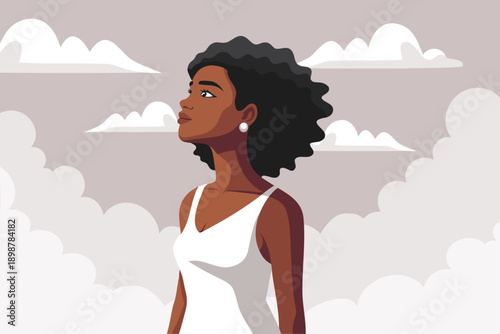 Beautiful African American woman in a white dress looking up at the sky. Confidence, feminine strength, women's empowerment concept.