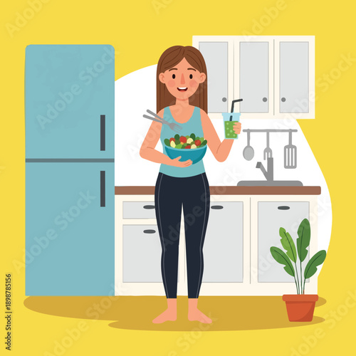 Smiling barefoot woman holding green smoothie and fresh vegetable salad bowl standing in bright modern kitchen interior with blue fridge