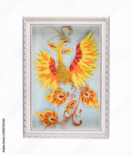 Colored paper firebird in a frame isolated on a white background
