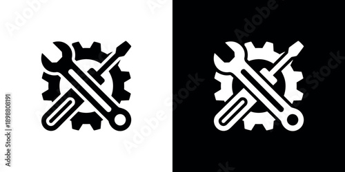 Black and white illustration of crossed wrenches and gears