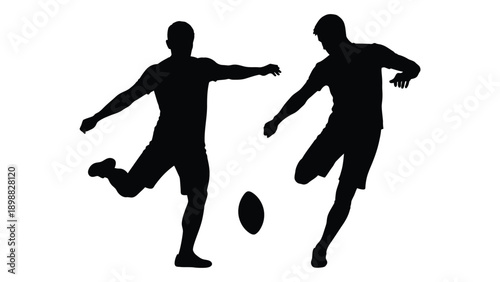 Two silhouetted figures playing with a ball likely a game of football