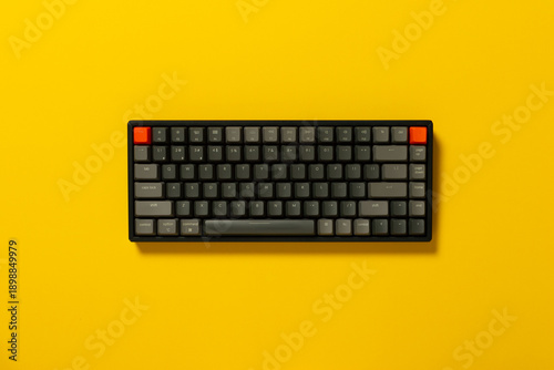 Overhead view of a mechanical keyboard on colourful background