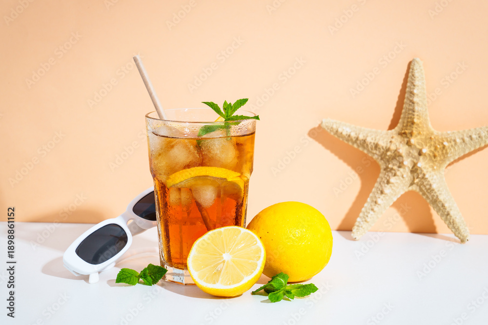 Fototapeta premium Summer cold drink on colored background with hard shadows.