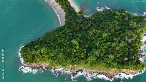 Top down aerial view of the iconic headland and narrow peninsula of Manuel Antonio National Park, Costa Rica.