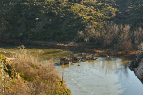 Serene river landscape with historical ruins