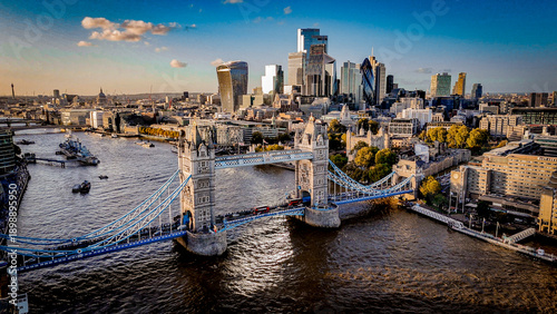 Obraz na plátně aerial view of London with Tower Bridge and The Shard at sunset, capturing dramatic light, strong contrast, and the city’s iconic skyline