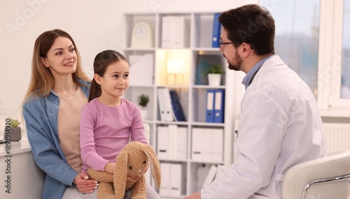 Photos Little girl and her mother having appointment with doctor in hospital