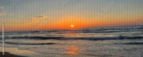 Sunset on the mediterranean sea with partially hidden sun, blur, colors eps10.
