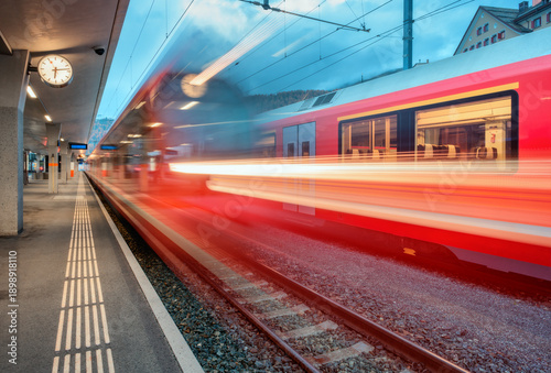 Blurred red passenger train...