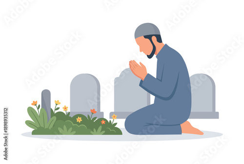 A man kneels in prayer at a serene cemetery with vibrant flowers and tombstones.