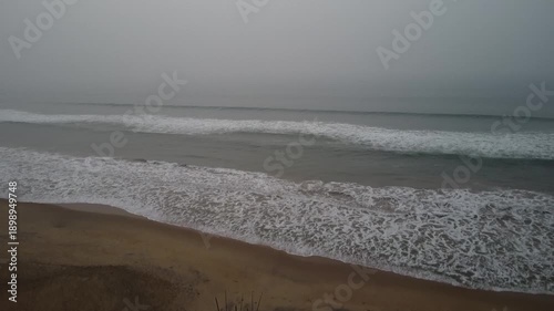 aerial top view drone video clip of scenic wave formation in a sea beach of famous travel destination city Puri in India