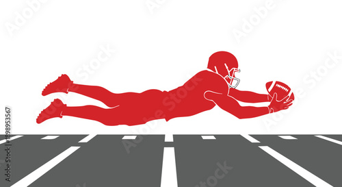 American football player diving to catch a ball on a field