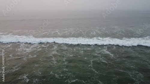 aerial top view drone video clip of scenic wave formation in a sea beach of famous travel destination city Puri in India