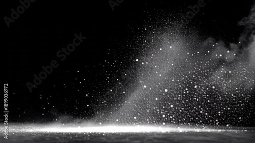 Abstract white dust particles and smoke explosion on black background dynamic motion of powder light effect cinematic slow motion.