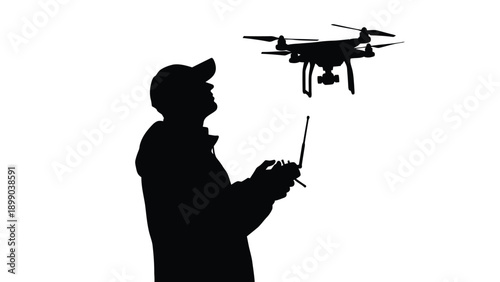 Silhouette of a person operating a modern quadcopter drone using a remote control transmitter against a bright white background in profile view