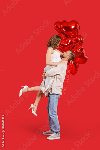 Happy young couple with hea...