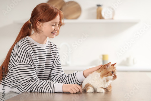 Redhead teenage girl with c...