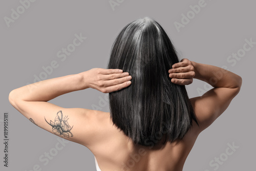 Young woman with graying ha...