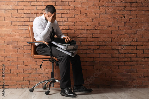 Businessman with folders in...