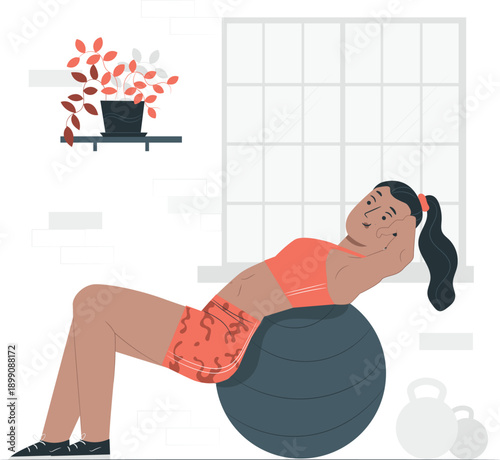 Woman exercising on large exercise ball in a fitness studio with equipment nearby and a fire effect in the background