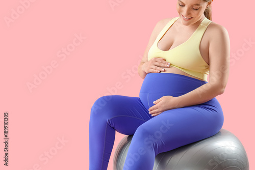 Sporty young pregnant woman...
