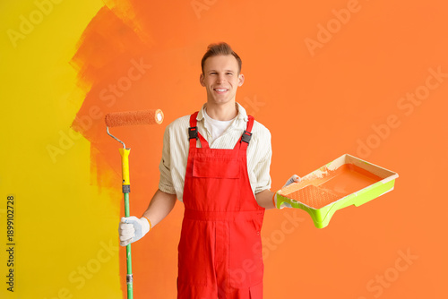 Male decorator with paint r...