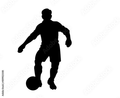 Silhouette of a professional soccer player dribbling a ball showing athletic movement 