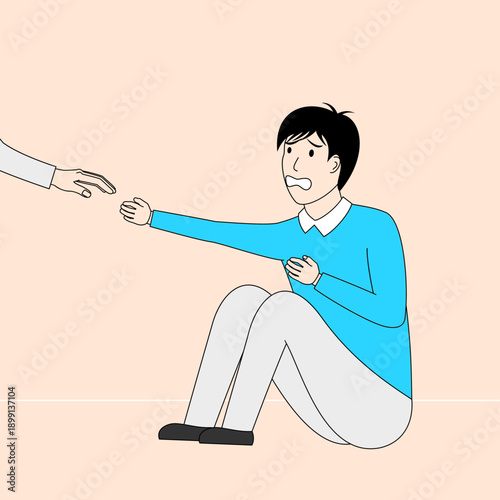 The boy sat on the floor sadly being bullied.