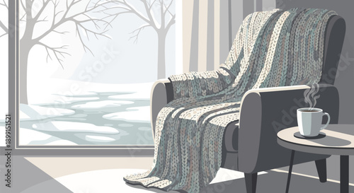 Cozy armchair with blanket and steaming cup on side table by large window overlooking snowy landscape with bare trees