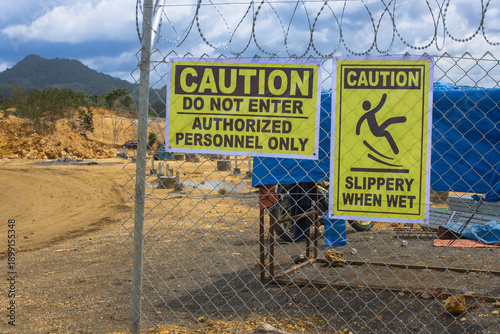 Safety First: Industrial Warning Signs at a High-Security Construction Site