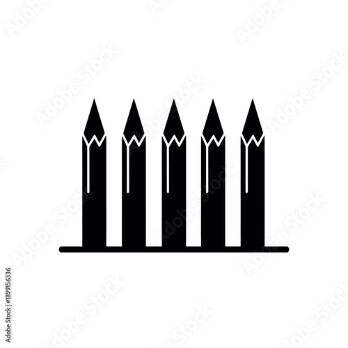 Black and white pencils lined up.