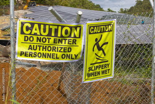 Safety First: Industrial Warning Signs at a High-Security Construction Site
