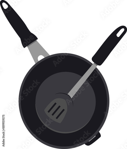 Black frying pan with spatula.