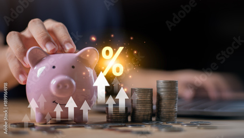 Tableau sur toile Piggy bank with rising coin stacks ,interest rate symbol savings growth, interest rate increase, financial planning, investment returns, inflation impact, banking, personal finance strategy
