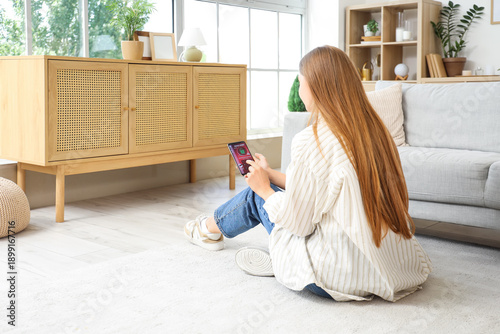 Young woman using mobile ph...