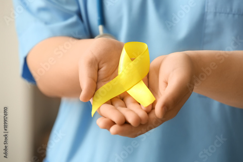 Doctor's hands with yellow ...