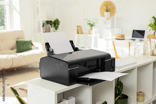 Modern printer on shelf in ...