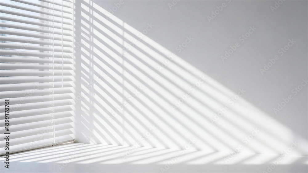 Fototapeta premium Minimalist white wall with shadow of window blinds and sunlight reflection