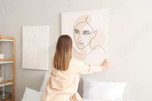 Young woman hanging stylish...