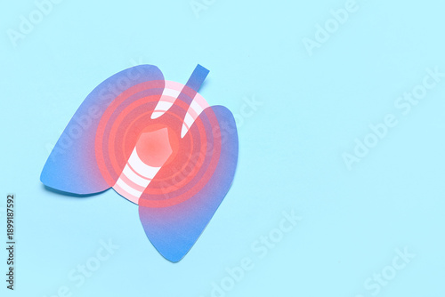 Paper lungs on blue background