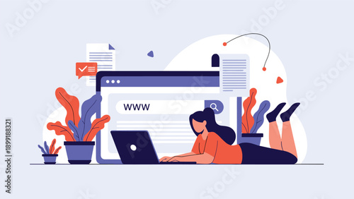 Young woman browses the internet while lying comfortably on the floor with her laptop and a large digital screen.