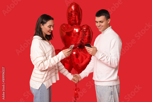 Young couple with mobile ph...