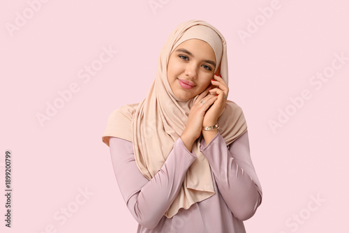 Happy young Muslim woman in...