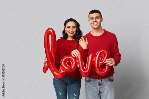 Loving young couple with ba...