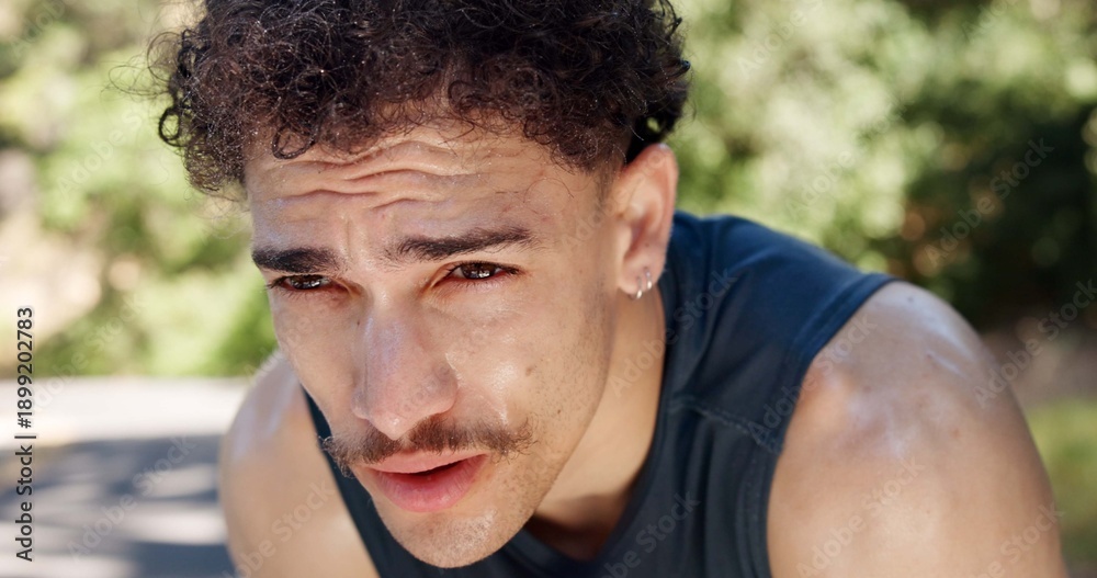 Fototapeta premium Exhausted, man and outdoor with sweat from cardio workout, endurance challenge and sports fatigue. Active person, tired or breathing in road with stop exercise, fitness rest or recovery for wellness.